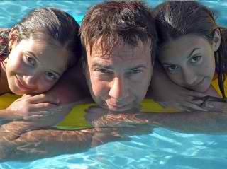 happy family swimming - Austin Custom Pool Builder